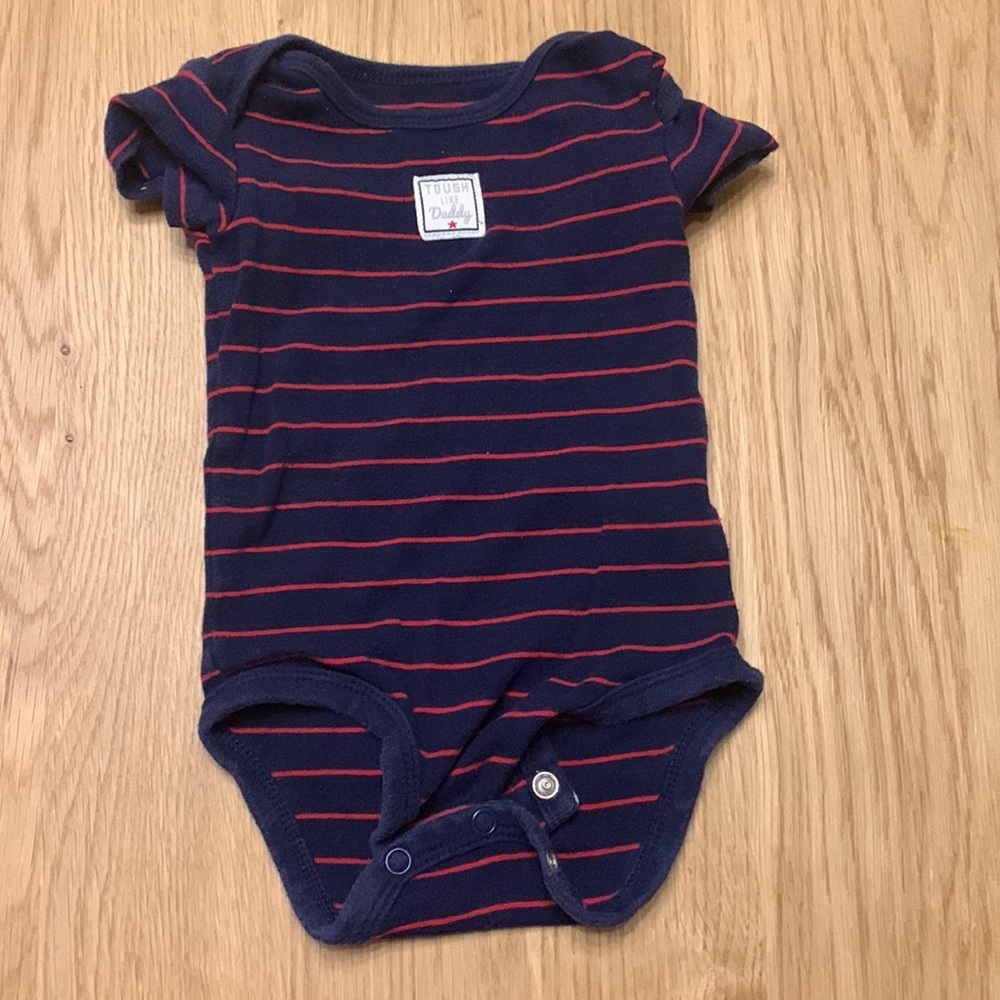 Carter’s striped “tough like dad” onesie